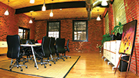 Modern design and style mixed with a charming brick and wood beam structure make 409 Canal street a creative, inspirational place to do business